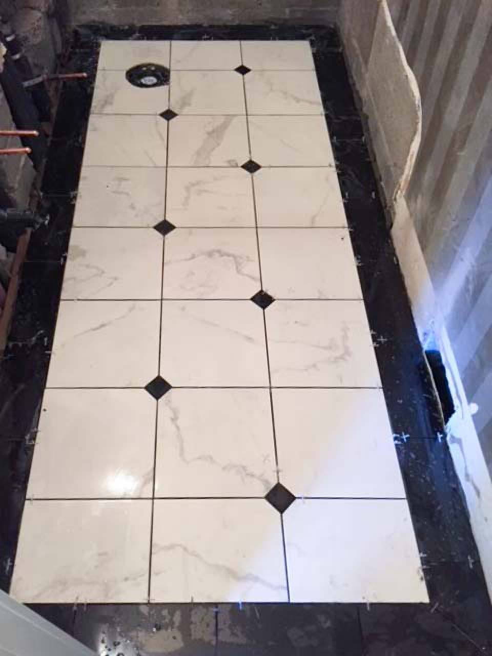 shower floor installation with black borders